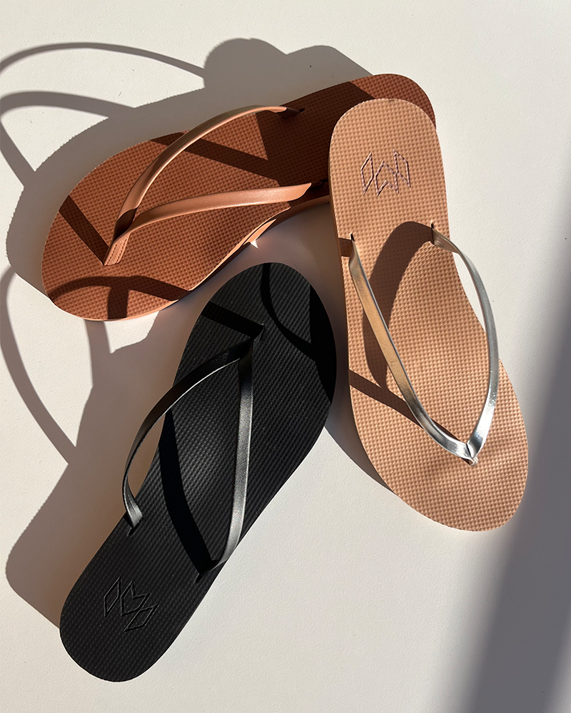 Group of earth toned flip flops with thin straps