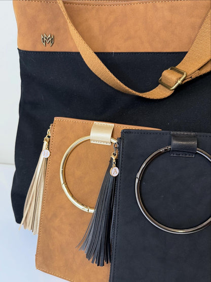 Monroe Messenger bag in Jet with brown adjustable strap and Parker Clutch