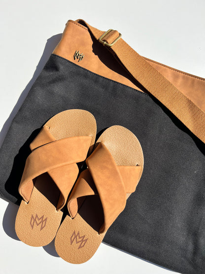 Ellie Cross in Saddle memory foam footbed with arch support and a brown criss cross strap paired with matching Monroe Messenger bag