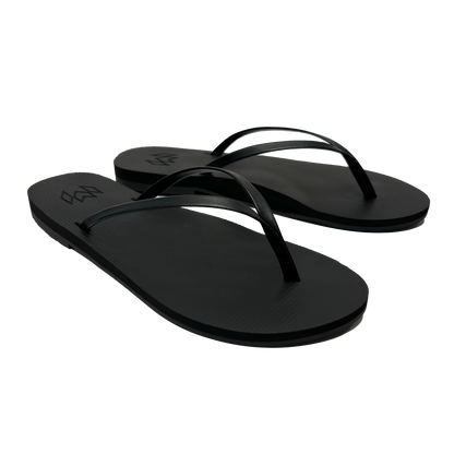 Lux Noir minimalist flip flop with thin strap and arch support in black